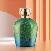 Grønn parfymeflaske i glass